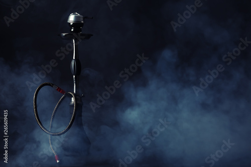 Obraz na płótnie Hookah with fume on dark background
