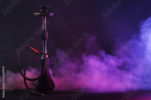 Hookah with fume on dark background