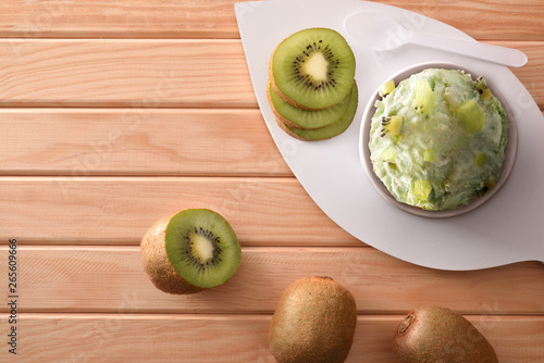 Kiwi ice cream cup decorated with sliced kiwi top