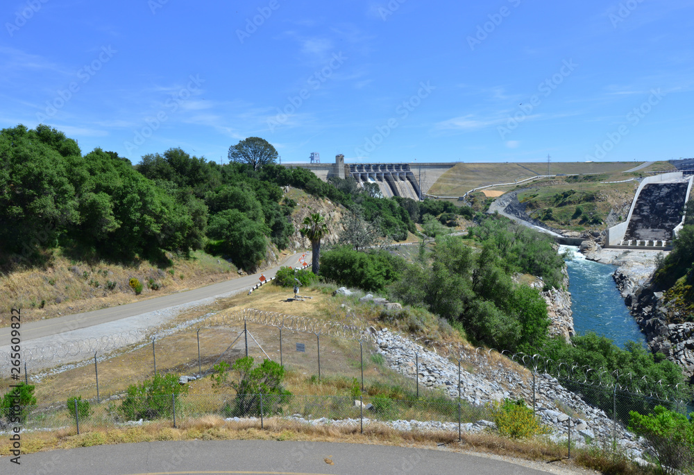 Folsom Dam in California with a sluice gaten open..