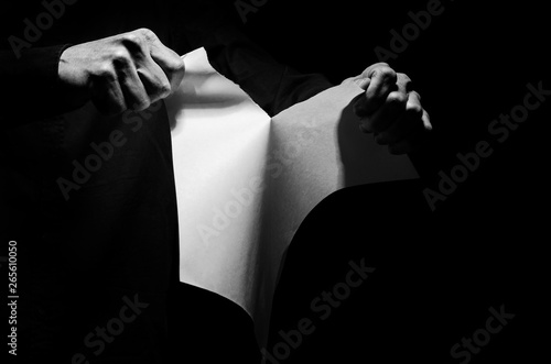 Canvas Print Man tearing a piece of paper.