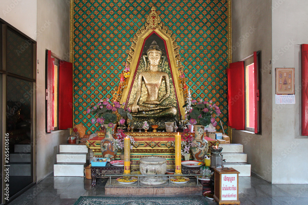 altar and statue of buddha in a buddhist temple (Wat Phra Si Rattana Mahathat) in Suphan Buri (Thailand)