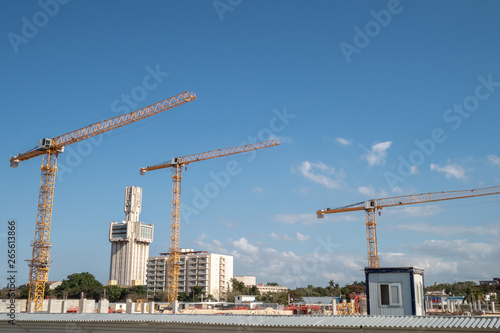Yellow cranes on a building site in Havana, Cuba