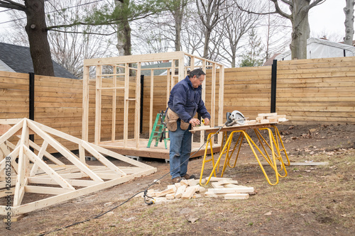 carpenter working on wood structure