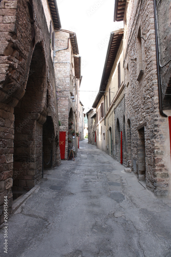 Small medieval alley in Spello city ( Umbria Italy )