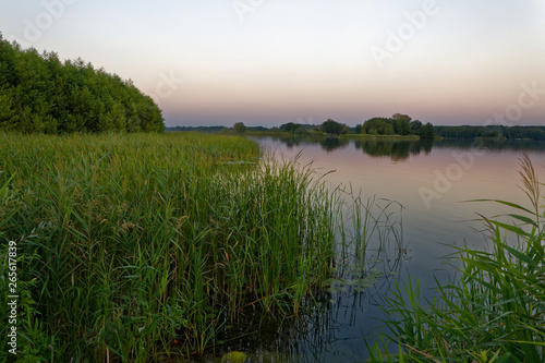 The evening fell on the village lake of the Russian hinterland.