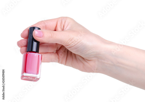 Red nail polish in hand on a white background. Isolation