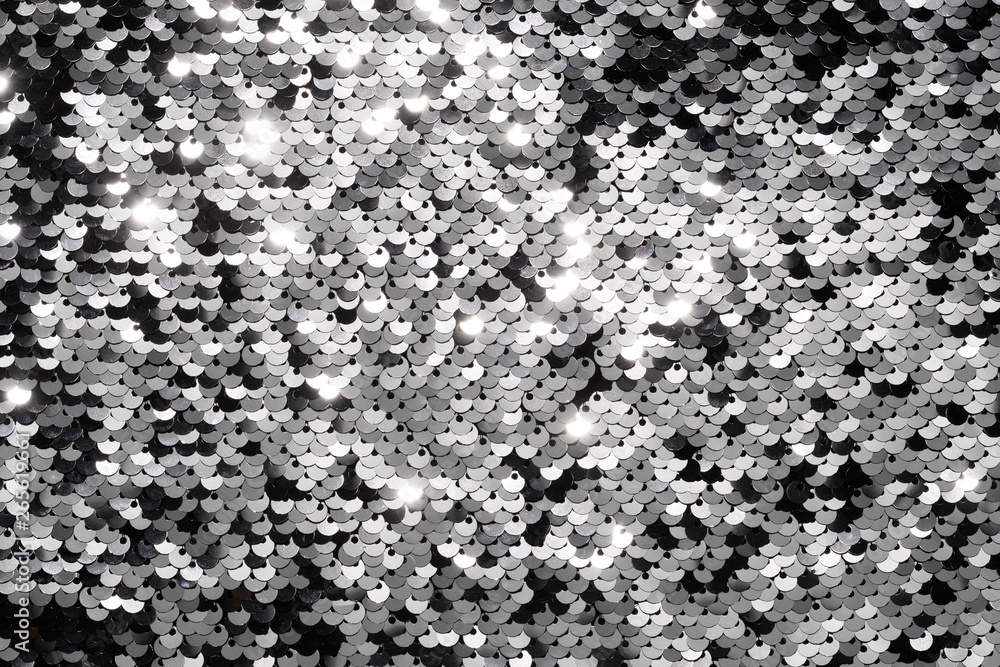 Obraz premium Sequin fabric background. Close-up shot of glittery black sequins texture