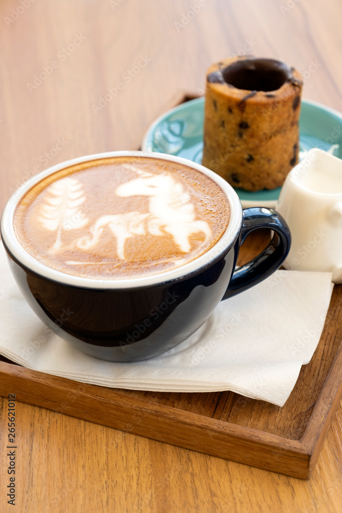 Hot latte with cookies on a wooden table Hot latte with cookies on a wooden table