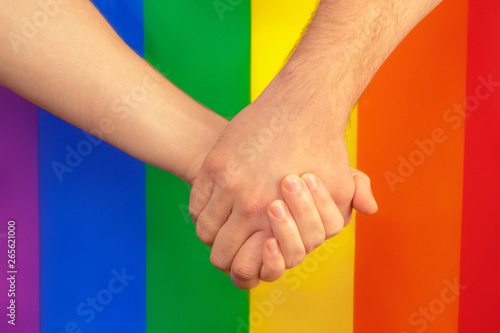 closeup of a gay couple holding hands