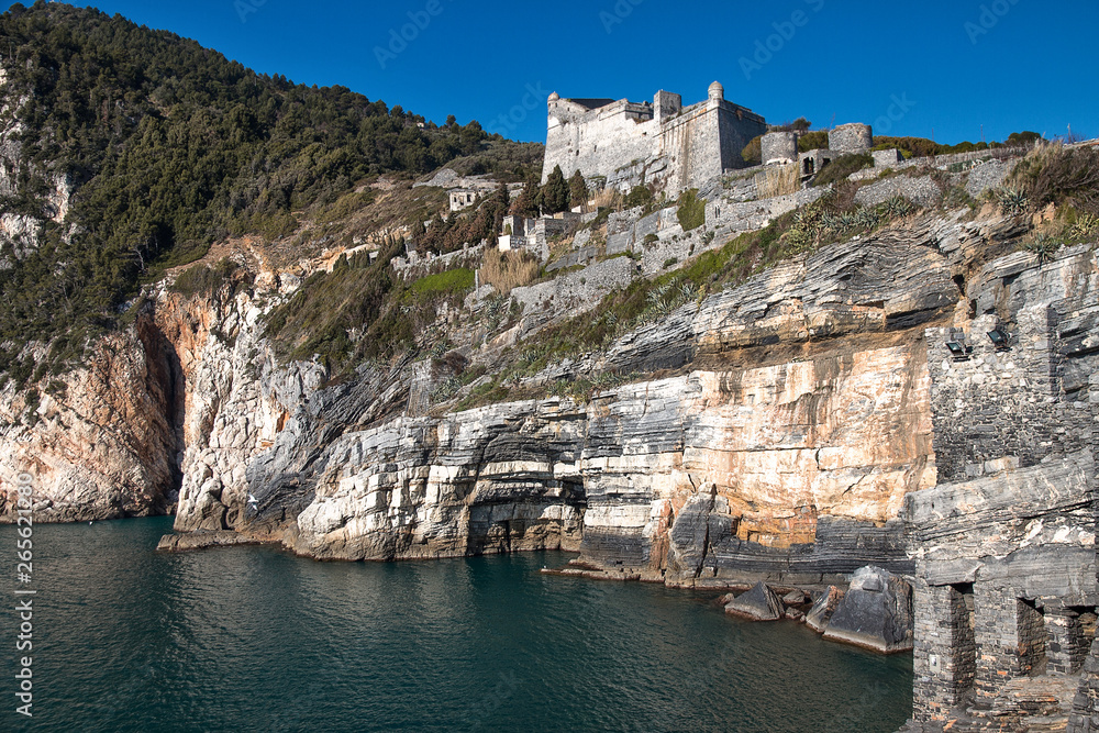 Doria fortress on cliff in Porto Venere on a sunny day, Cinque Terre, Liguria, Italy