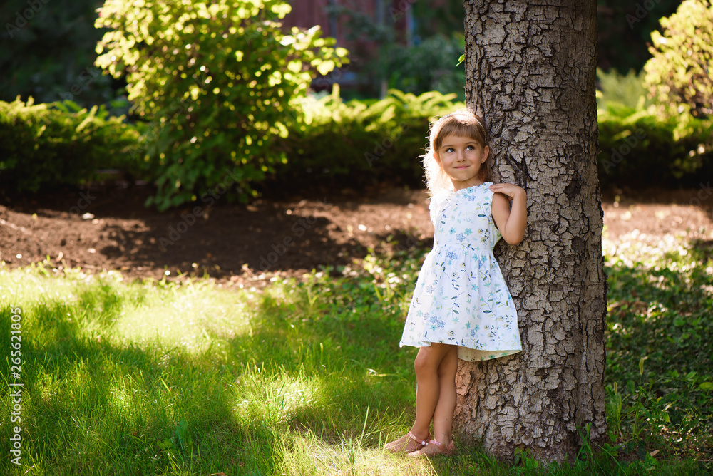 Beautiful little young girl outdoorin a park. Beautiful little young girl outdoorin a park.