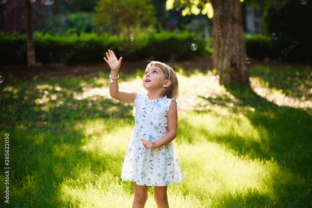 Girl with bubbles at a sunny summer evening Girl with bubbles at a sunny summer evening