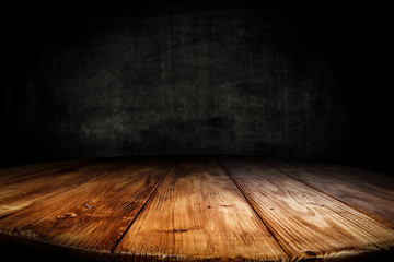 Dark desk background of free space for your decoration and black wall space 