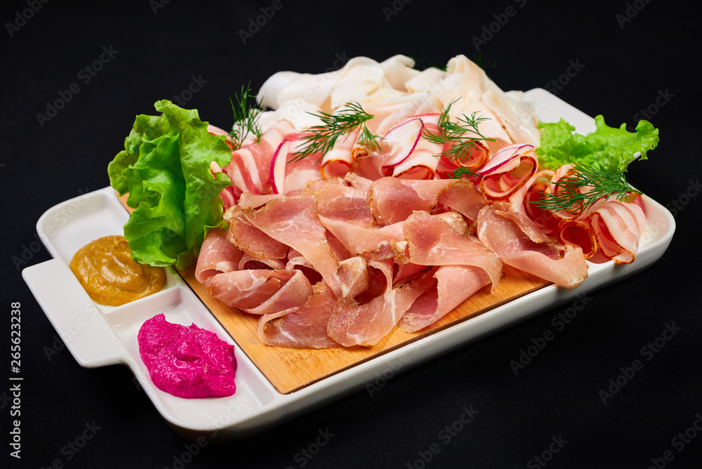 meat and sowbelly set. pub, restaurant, bar food concept. meat appetizers set with meat, sowbelly, tomatoes cherry, souses and fresh greens. meat and sowbelly set. pub, restaurant, bar food concept. meat appetizers set with meat, sowbelly, tomatoes cherry, souses and fresh greens.
