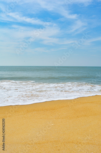 Soft wave lapped the sandy beach