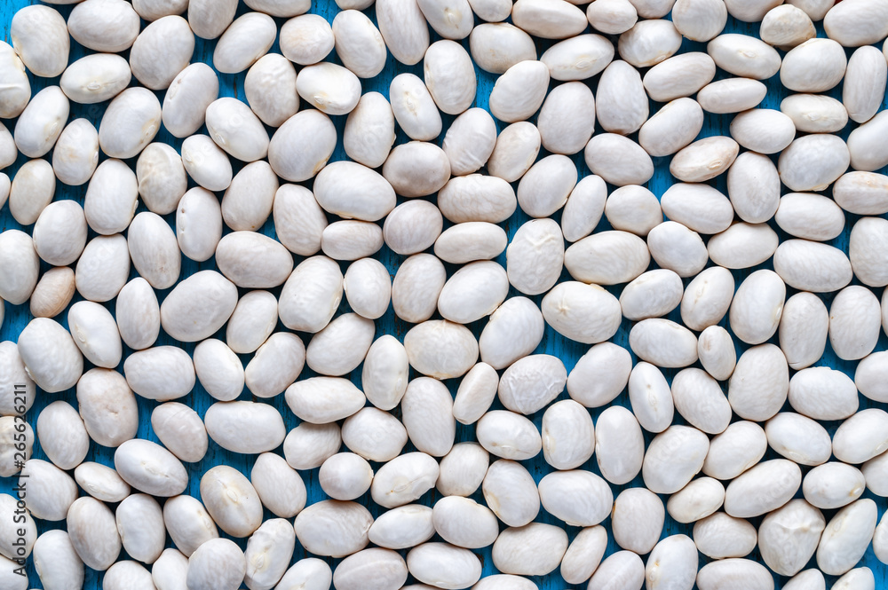 White beans. Background with lots of white bean beans. White beans. Background with lots of white bean beans.
