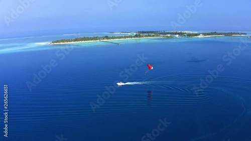 Aerial view, paraglider flies along an atoll of Maldives, South Male Atoll Maldives photo