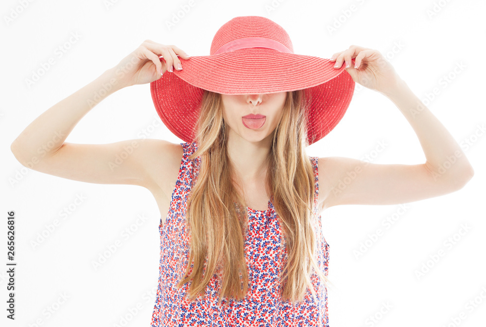 Beautiful attractive girl hides her face behind her summer hat and shows her tongue isolated over white. Beautiful attractive girl hides her face behind her summer hat and shows her tongue isolated over white.