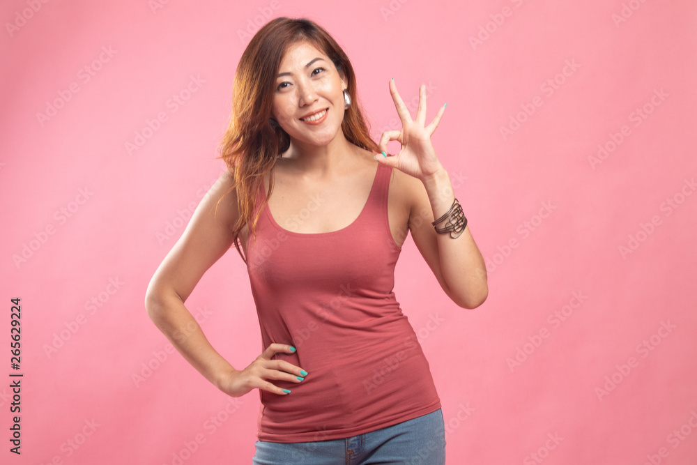 Young Asian woman show OK sign. Young Asian woman show OK sign.