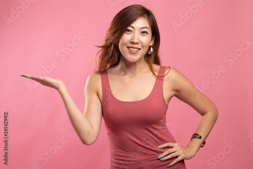 Beautiful young Asian woman show palm hand.