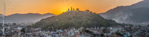 Sunset over a temple in Kathmandu, Nepal photo