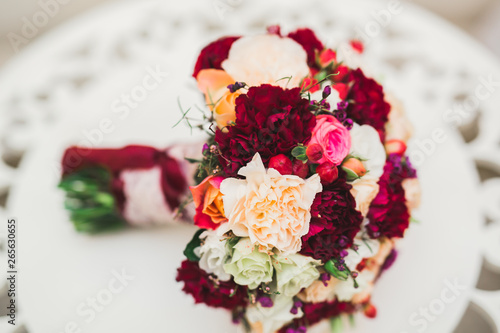 Beautiful wedding bouquet with different flowers, roses