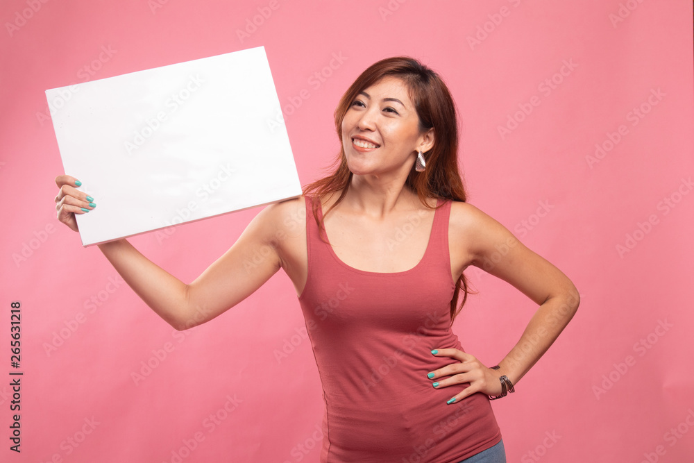 Young Asian woman with white blank sign. Young Asian woman with white blank sign.