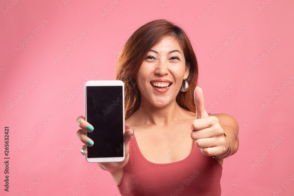 Young Asian woman show thumb up with mobile phone. Young Asian woman show thumb up with mobile phone.