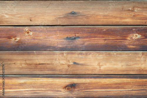 brown wooden wall with nails