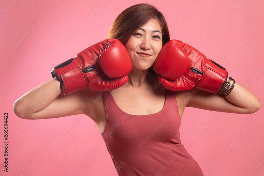 Young Asian woman with red boxing gloves. Young Asian woman with red boxing gloves.