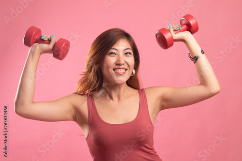 Healthy Asian woman with dumbbells.