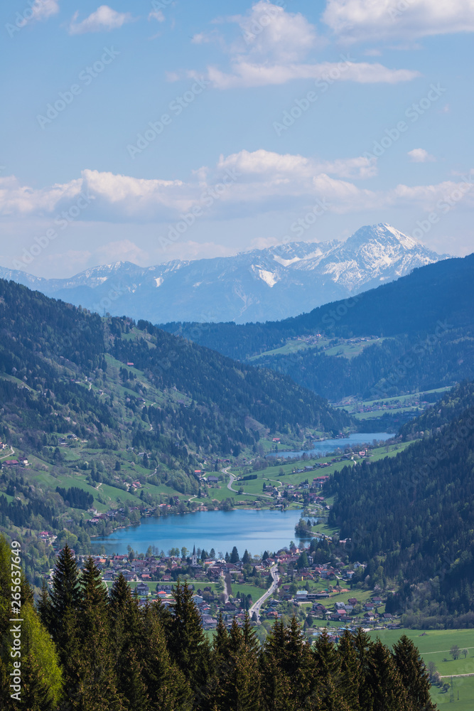 Wonderful Spring Mountain Landscape Panorama View Through Valle Gegendtal With Lake Brennsee And Lake Afritz And Mt. Mittagskogel In Background