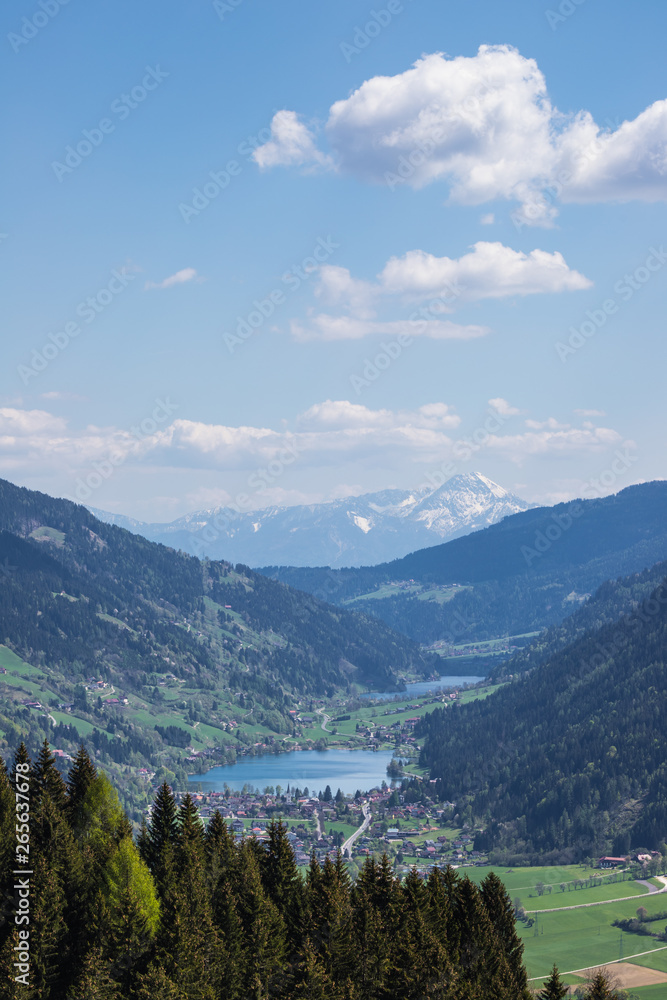 Wonderful Spring Mountain Landscape Panorama View Through Valle Gegendtal With Lake Brennsee And Lake Afritz And Mt. Mittagskogel In Background