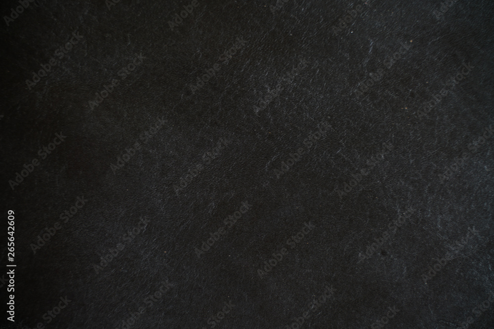 Abstract genuine tanned leather black background
