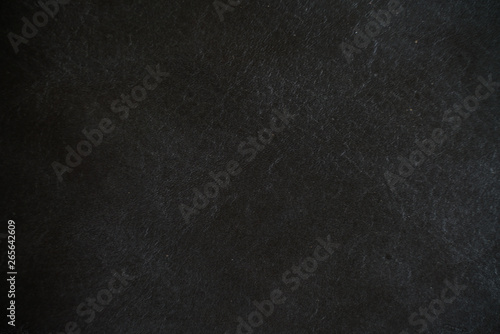 Abstract genuine tanned leather black background