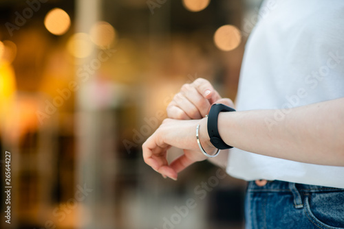 Female hand with smart bracelet.Smart watch on the wrist. © Elina