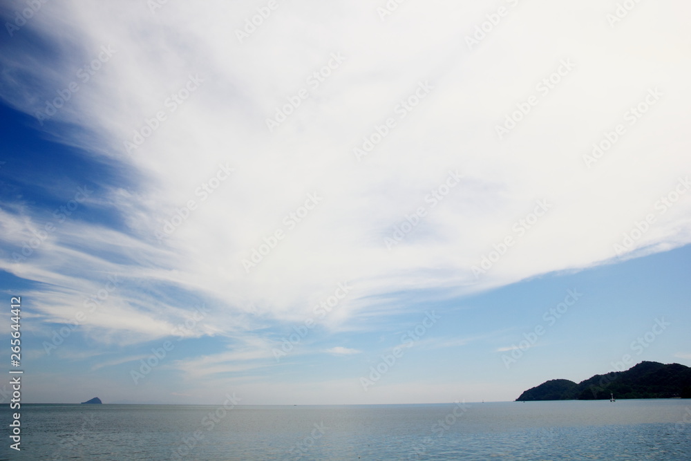 Blue sky with clouds over the sea for background, wallpapers, seascape and clear sky  background.
