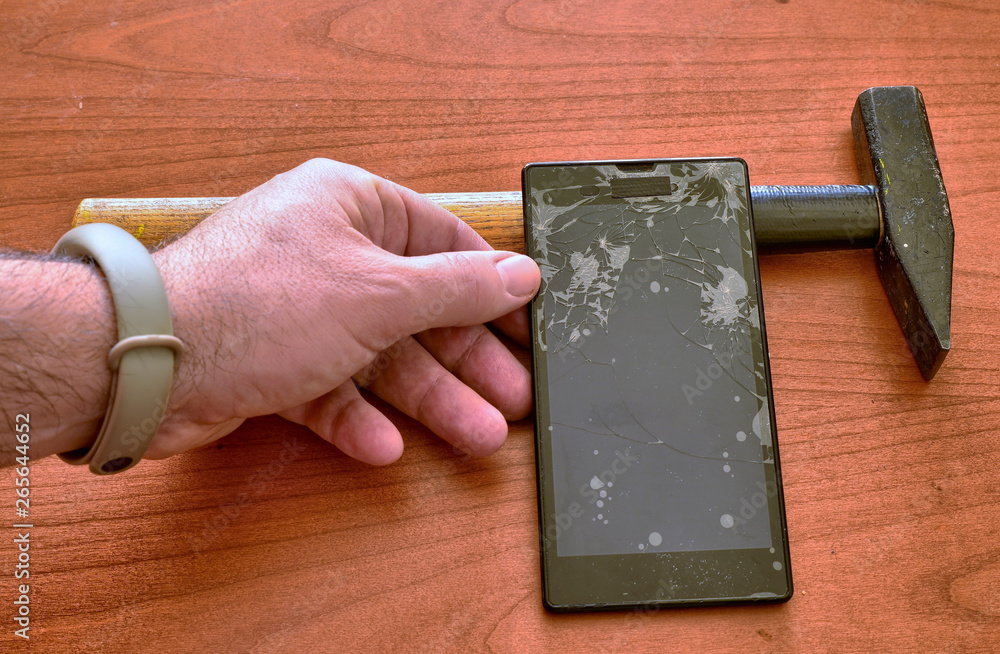A smartphone with a broken screen and a thousand crack A smartphone with a broken screen and a thousand crack