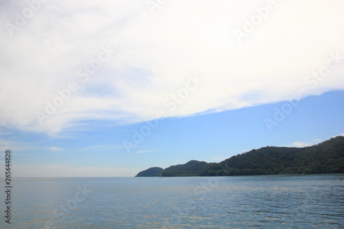 Blue sky with clouds over the sea for background, wallpapers, seascape and clear sky background.