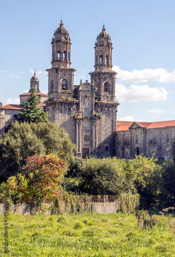 Gothic cathedral in the camino of Santiago in a sunny day surrounded by nature
