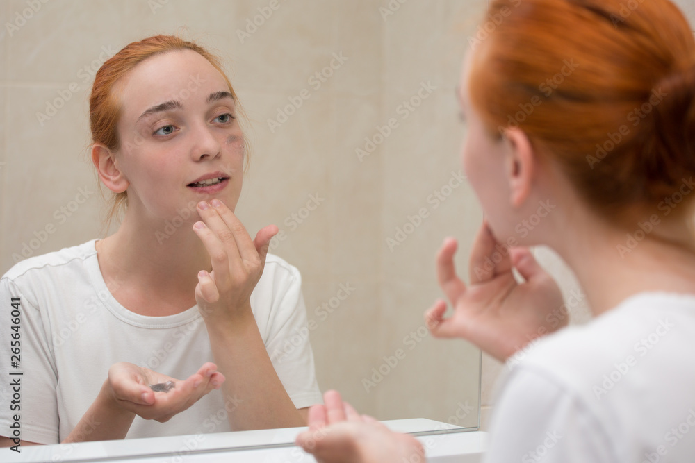 a young woman is  washing