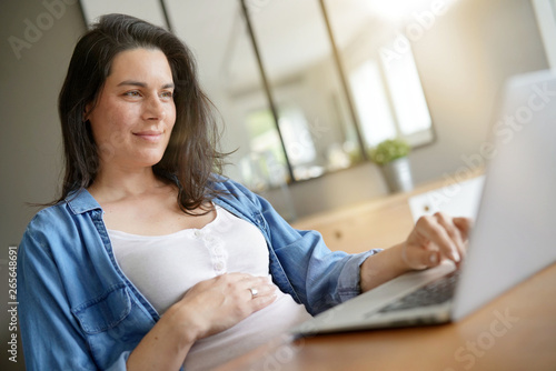 Pregnant woman working from home with laptop Free Download Pregnant woman working from home with laptop - GFXLoad