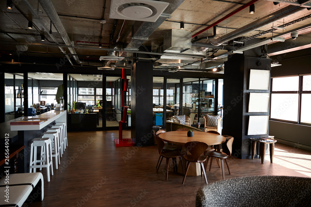 Bar and dining area in the office of a creative business, in daylight, no people Bar and dining area in the office of a creative business, in daylight, no people