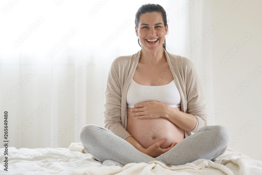 Portrait of pregnant woman relaxing in bed Portrait of pregnant woman relaxing in bed
