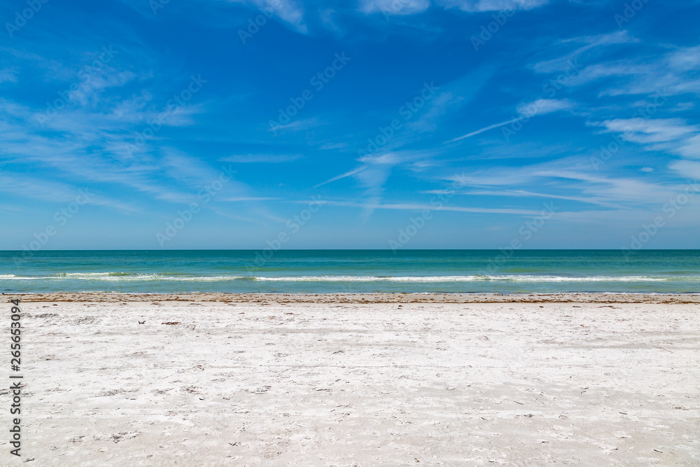 A sandy beach on the Florida Gulf Coast, on a sunny day