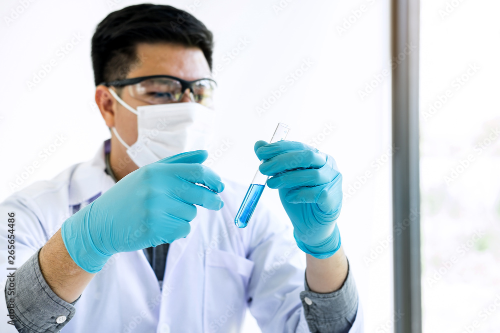 Biochemistry laboratory research, Chemist is analyzing sample in laboratory with equipment and science experiments glassware containing chemical liquid Biochemistry laboratory research, Chemist is analyzing sample in laboratory with equipment and science experiments glassware containing chemical liquid