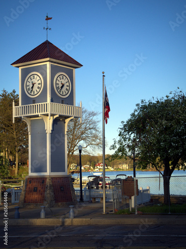 Clock Tower near Lake with Ohio State Flag on a Pole