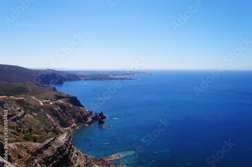 View of the blue azure sea lagoon gulf of the ocean. Summer heat nature on the southern island of the mountain rocks stones. © Payllik