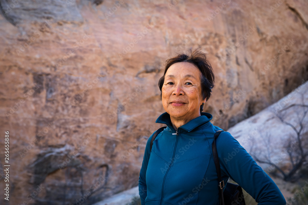 Portrait of Senior Asian Woman in the desert landscape of Valley of Fire, Nevada, North America Portrait of Senior Asian Woman in the desert landscape of Valley of Fire, Nevada, North America
